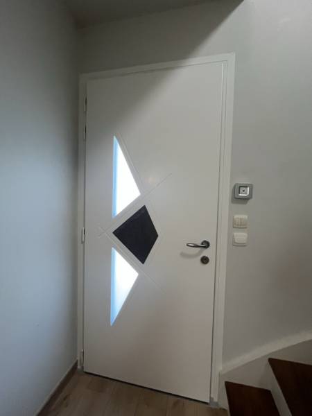 pose de porte de garage sur-mesure par ETANEL à Normanville