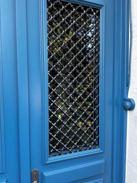 Détail grille porte entrée bois ATULAM Normandie ETANEL